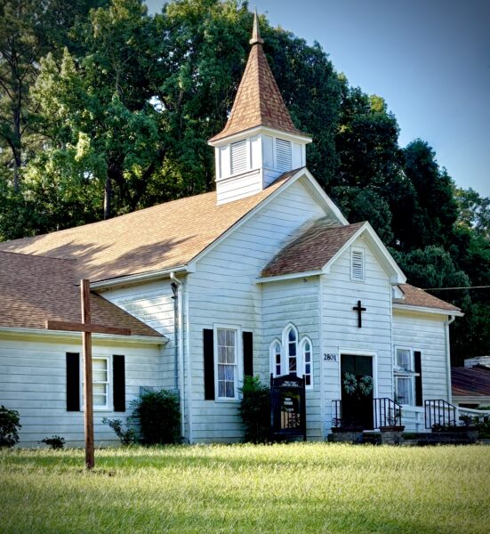 a small white church building