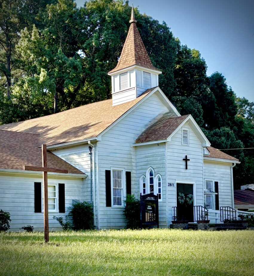 a small white church building