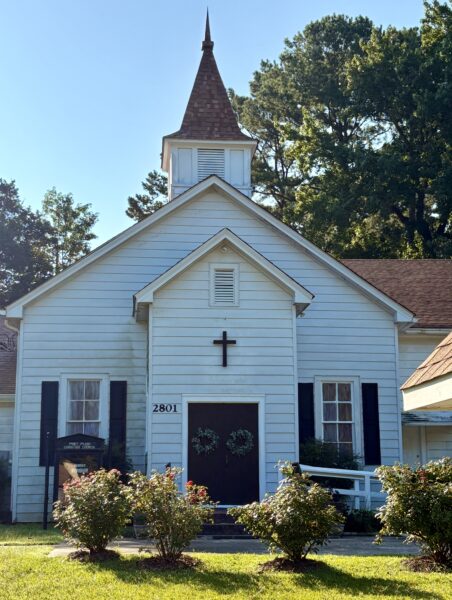 front view of a small white church building
