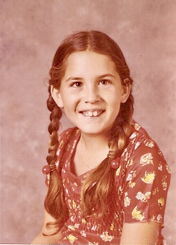 a young girl with her hair in braids